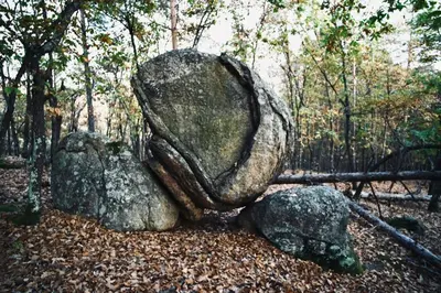 a large rock sitting on top of some rocks at Iliikova House in Kalofer