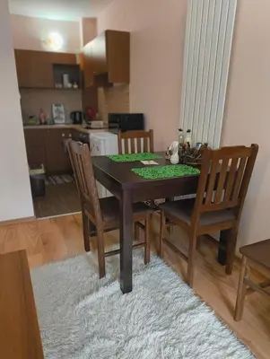 a dining room table and chairs in a kitchen at Evrika home 21 in Pamporovo