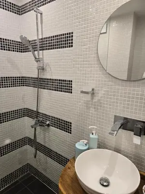a bathroom with a sink and a shower at Apartment at White Lavina Hotel in Bansko