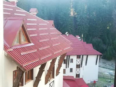 a red roof on top of a building at Апартамент 109 Комплекс 