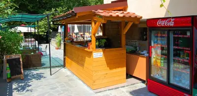 a small store with a coca cola counter at Family Prim Hotel in Sandanski