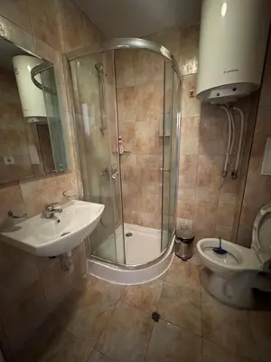 a bathroom with a shower and a sink and a toilet at Pamporovo Apartment 314 The Castle 3 in Pamporovo