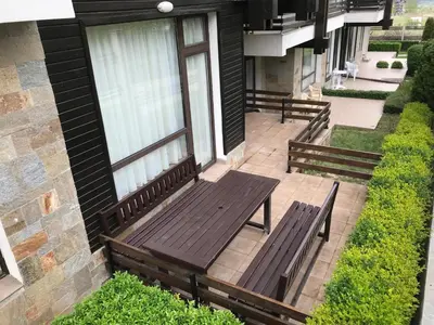 a group of benches sitting on a patio at ASPEN GOLF RESORT K004 Ski & Spa RELAX APARTMENT in Razlog