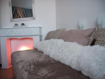 a living room with a couch and a fireplace at Apartment 15 in Borovets