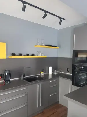 a kitchen with a sink and a stove top oven at LUXURY SUITES in Karlovo
