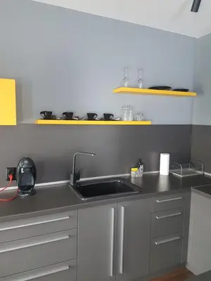 a kitchen with a sink and a counter top at LUXURY SUITES in Karlovo