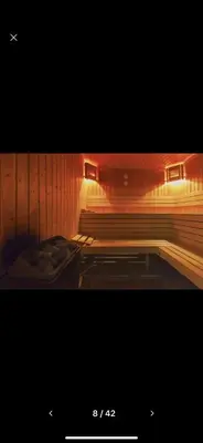 a picture of a room with wooden walls and benches at Terra Complex SPA apartment 1 bedroom suite in Razlog