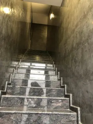 a shadow of a person walking down a stairs at При Павката (Pri Pavkata) in Samokov