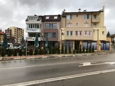 a large building on the side of a street at При Павката (Pri Pavkata) in Samokov