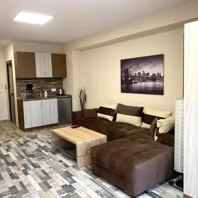 a living room with a couch and a table at При Павката (Pri Pavkata) in Samokov