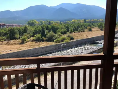a view of a train track from a balcony at Mountain View Apartment in Bansko