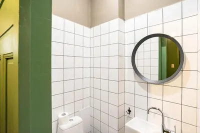 a bathroom with a mirror and a sink at Beautiful best location apartment Green Mouse in Plovdiv