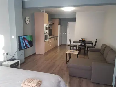 a living room with a couch and a table at LUXURY SUITES 3 in Karlovo