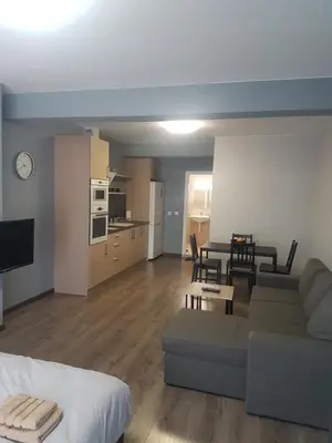 a living room with a couch and a table at LUXURY SUITES 3 in Karlovo