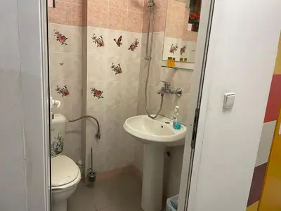 a bathroom with a sink and a toilet at Central House for up to 16 Guests Entire Place in Sofia