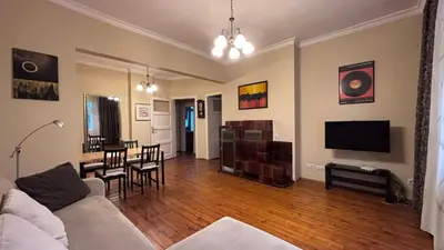 a living room with a couch and a dining room at 66 in Sofia in Sofia