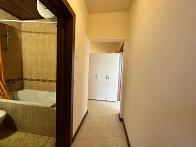 a bathroom with a tub and a toilet and a sink at Neon Luxury apartments next to the Gondola in Bansko