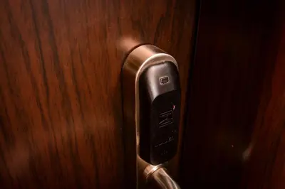 a close up of a door handle on a wooden door at Guest house VRAZHDEBNA in Sofia