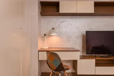 a desk with a lamp and a chair in a room at The Grunge Spot - Charming NEW 1-Bedroom by Flat Mаnager in Sofia