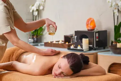 a woman laying on a towel getting a massage at Hyatt Regency Sofia in Sofia