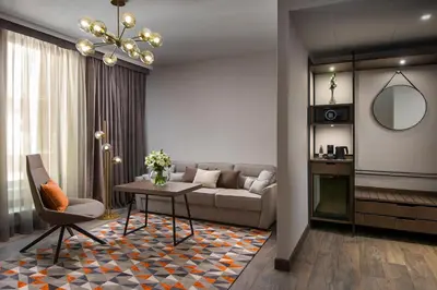 a living room with a couch and a table at Hyatt Regency Sofia in Sofia