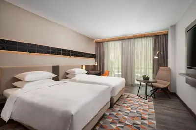 a hotel room with two beds and a window at Hyatt Regency Sofia in Sofia