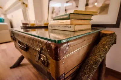 a stack of books sitting on top of a table at Off Vitosha Blvd Designer Apart in Sofia
