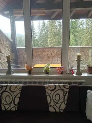 a window with two chairs in front of it at Спа,ски апартамент Дайли, Стрийм Ризорт Пампорово in Pamporovo
