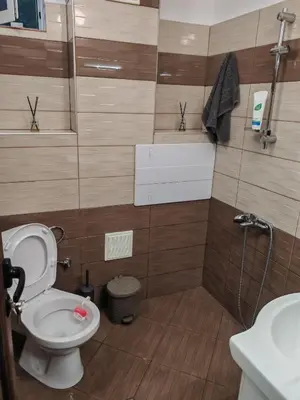 a bathroom with a toilet and a sink at Iskra Apartment in Sofia