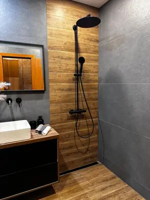 a bathroom with a shower and a sink at Deluxe 206 in Borovets