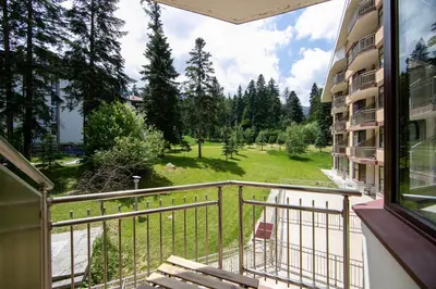 a balcony of a building with a view of a park at Deluxe 206 in Borovets