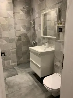 a bathroom with a toilet and a sink and a mirror at Silver Box Pamporovo in Pamporovo