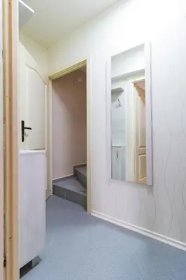 a hallway with a mirror on a wall at The Perfect One-Bedroom Maisonette in Plovdiv by Flat Mаnager in Plovdiv