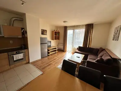 a living room with a couch and a table at Top Lodge twobedroom apartment in Bansko