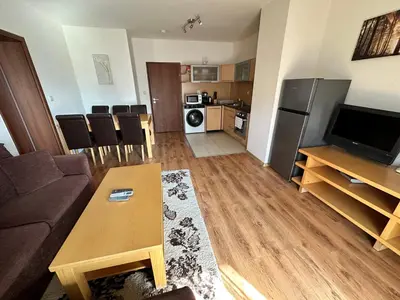 a living room with a couch and a table at Top Lodge twobedroom apartment in Bansko