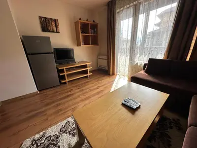 a living room with a couch and a coffee table at Top Lodge twobedroom apartment in Bansko