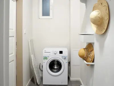 a white laundry room with a washer and dryer at Caché - Bright One-Bedroom Apartment in Sofia by Flat Mаnager in Sofia