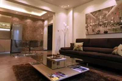 a living room with a couch and a table at Brown Cottage Apartment in Sofia