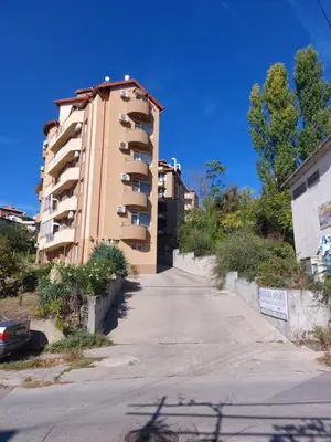 an empty street in front of a building at Apartament Emi in Sandanski
