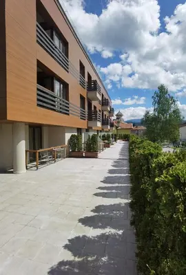 an empty sidewalk in front of a building at Aqua Viva Spa Hotel in Velingrad