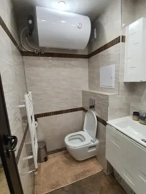 a small bathroom with a toilet and a sink at VIP apartment & parking in Sofia