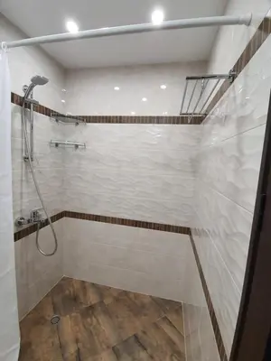 a bathroom with a shower with a glass door at VIP apartment & parking in Sofia
