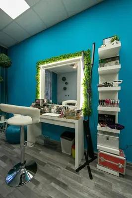 a bathroom with a vanity with a mirror and a stool at Hotel Iceberg Borovets in Borovets