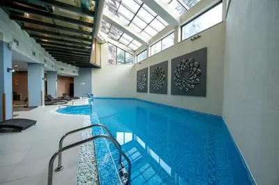 a large swimming pool in a building at Hotel Iceberg Borovets in Borovets