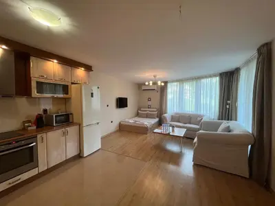 a large living room with a kitchen and a living room at Apartment City Park Sandanski in Sandanski