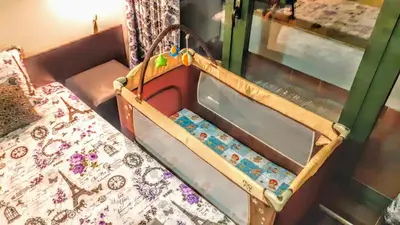 a childs bed with a crib in a room at Sunny Days - Park Apartment in Sandanski