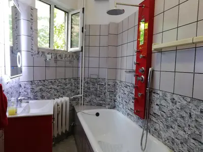 a bathroom with a tub and a sink at TOP CENTER spacious apartment with free parking in Sofia