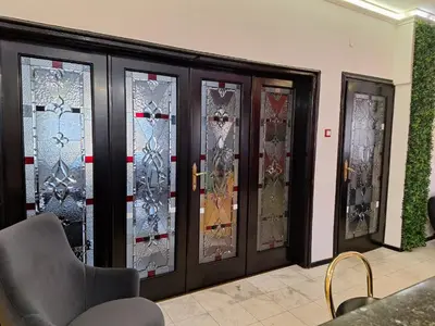 a group of stained glass doors in a room at TOP CENTER spacious apartment with free parking in Sofia