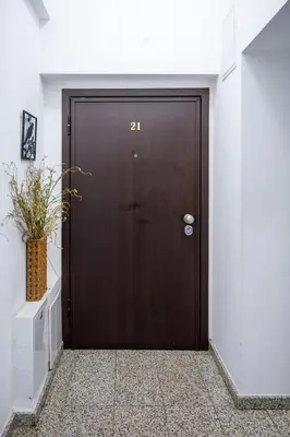 a brown door with the number on it at Sunny Studio with a view in TOP Center in Sofia