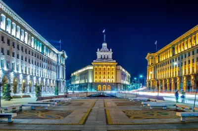 a lit up building in a city at night at Sunny Studio with a view in TOP Center in Sofia